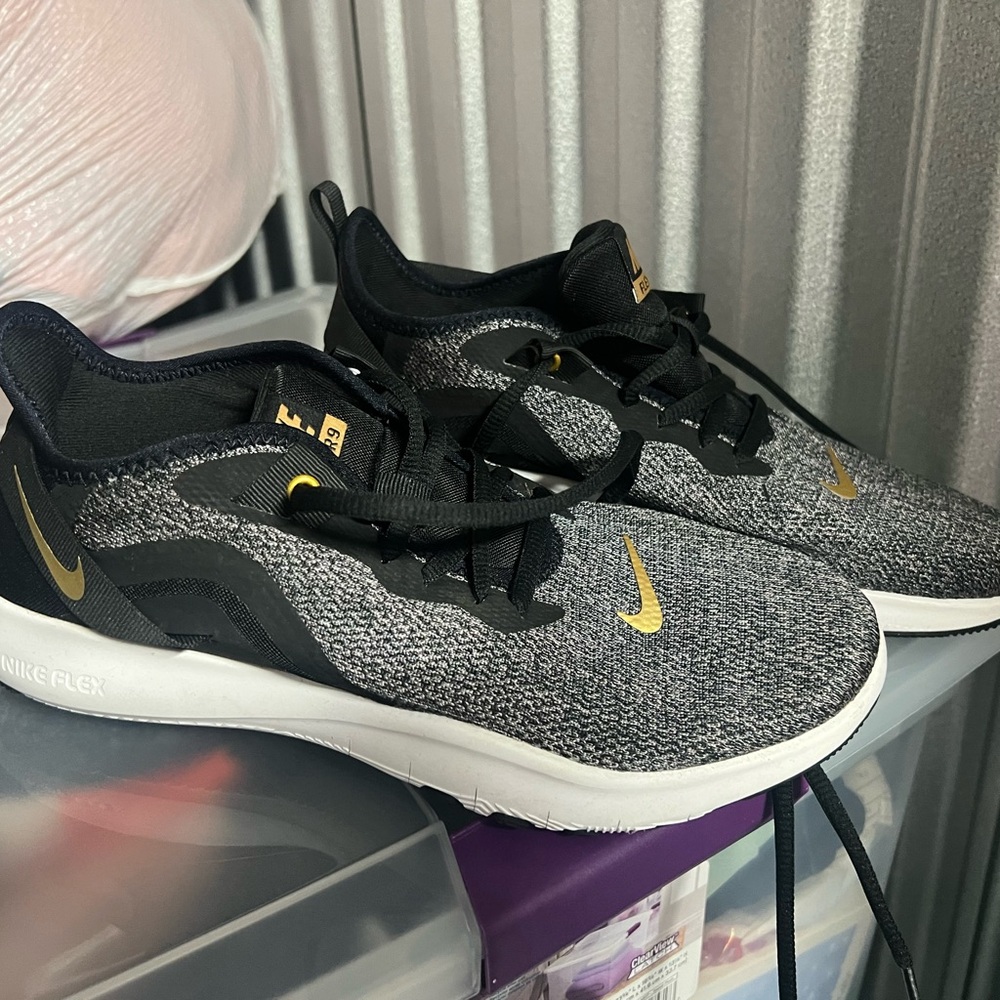 Nike Flex Black and Gold Athletic Shoes